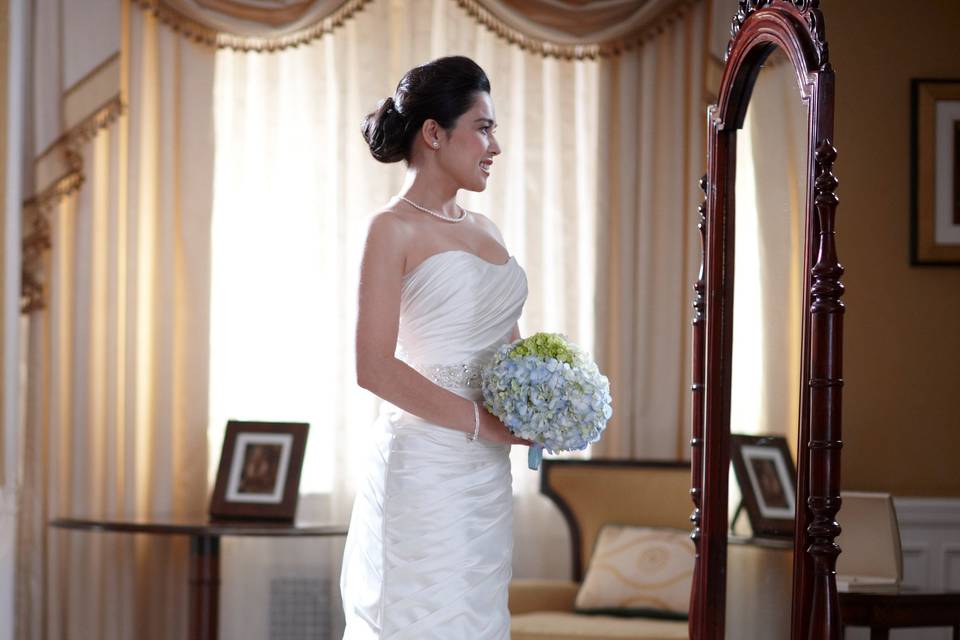 Bride looking in mirror