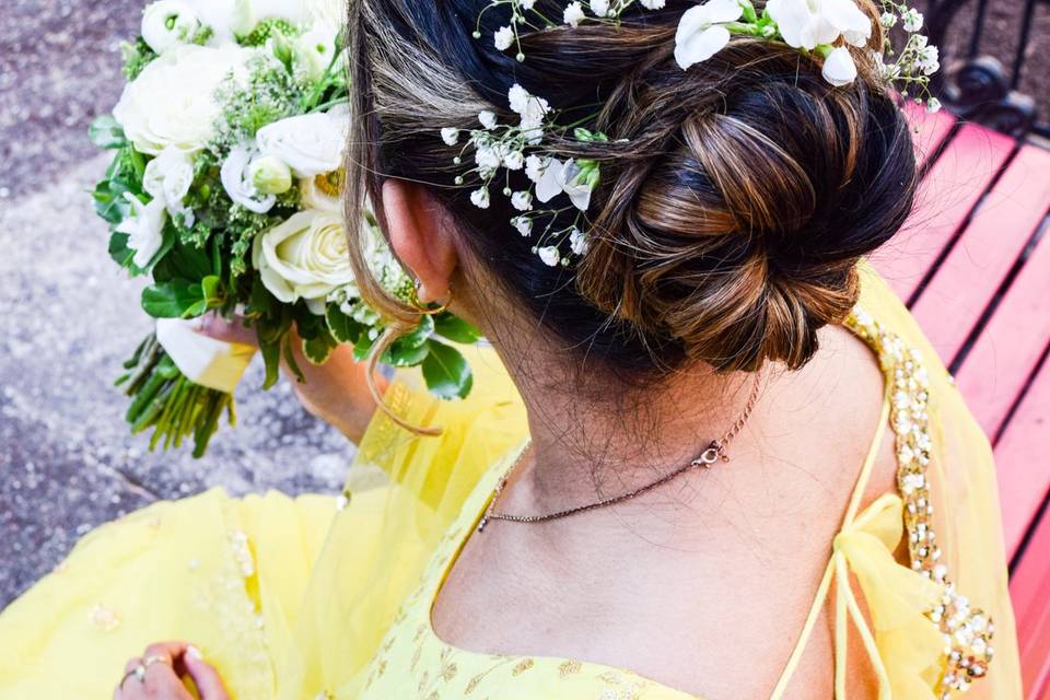 Twisted bun updo with flowers