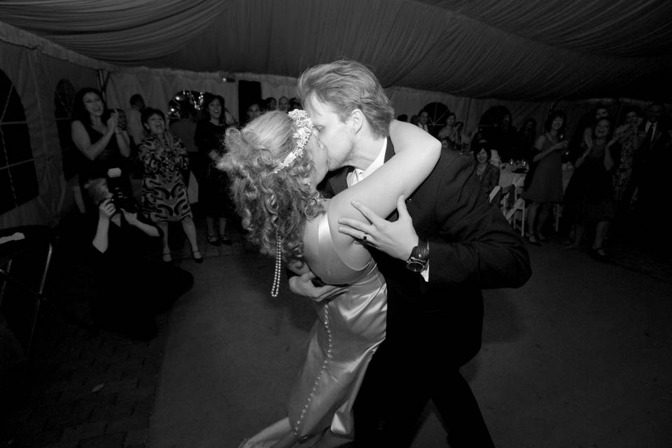 Beautiful couple enjoying a kiss at their wedding reception in the Washington, DC area.