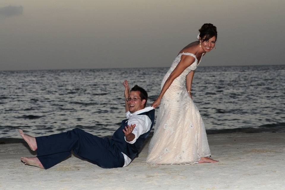 Bride pulling the groom along