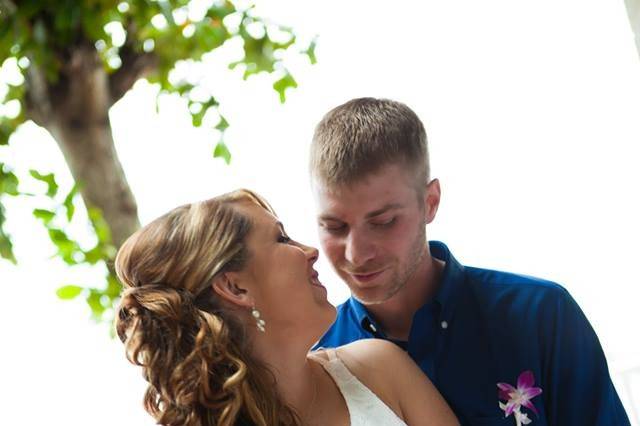 Groom holding his bride