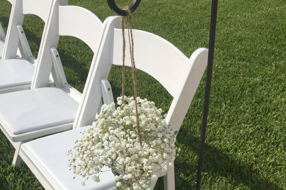 White chair with flower decor on the side