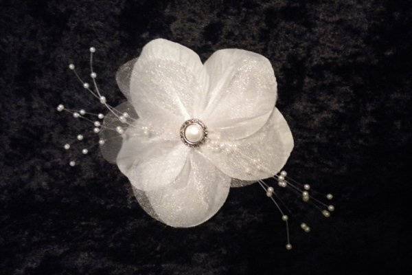 White handmade flower with beading and pearl center