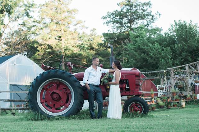 Newlyweds by the tractor