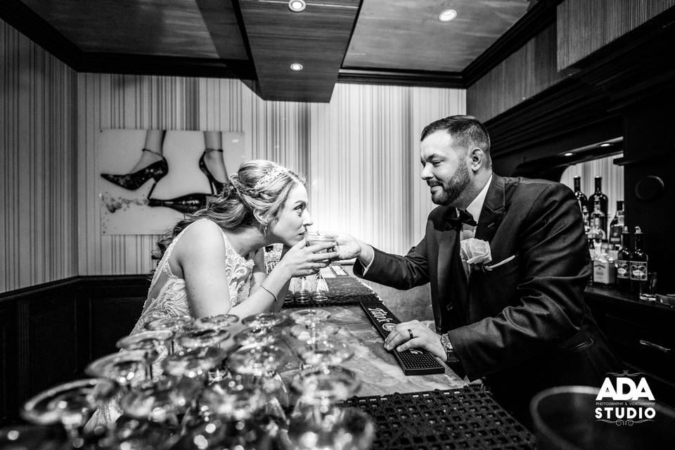 Bride and groom share drink
