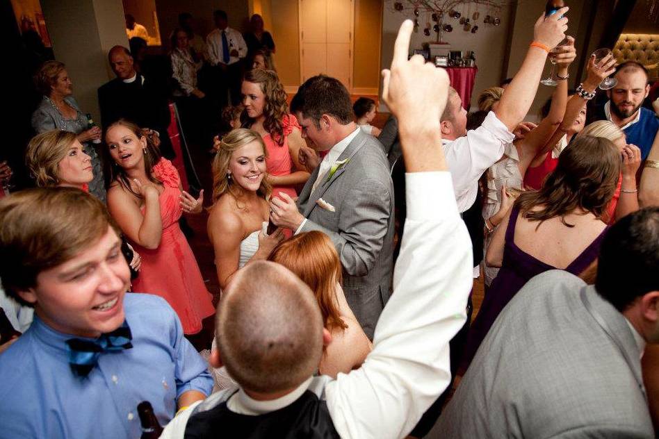 Couple and guests dancing