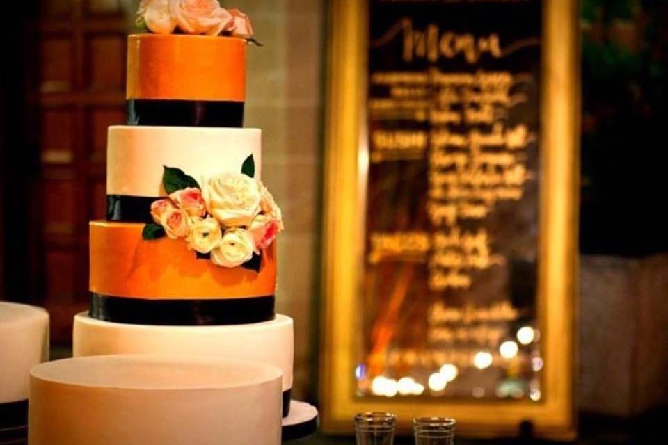 White and orange wedding cake