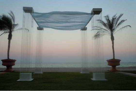 Acrylic Plexiglass structure by Arc Divine Miami at the Aqualina Sunny Isles FL $649.00, florals and delivery extra.  Arc Divine, exquisitely beautiful wedding Alters, Arches, Arcs, Canopies, Chuppahs and Mandaps, from the Ultra Modern to the classic and traditional.   www.ArcDivine.com 954.319.6126www.MiamiWeddingArches.com