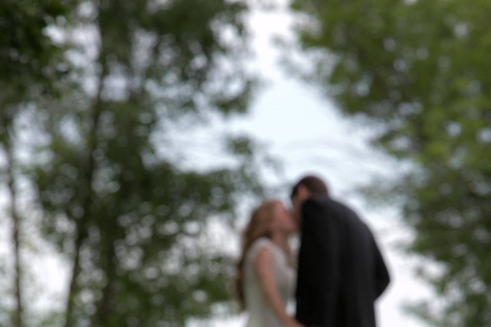 This little ring bearer just happened into this photo, completely fascinated with the grasses and clover scattered about.