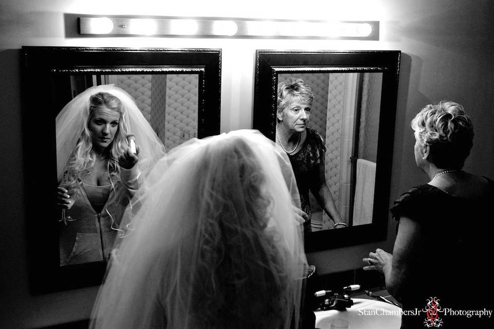 Bride & mother-of-the-bride putting on makeup prior to the ceremony. Picture by www.stanchambersjr.com.