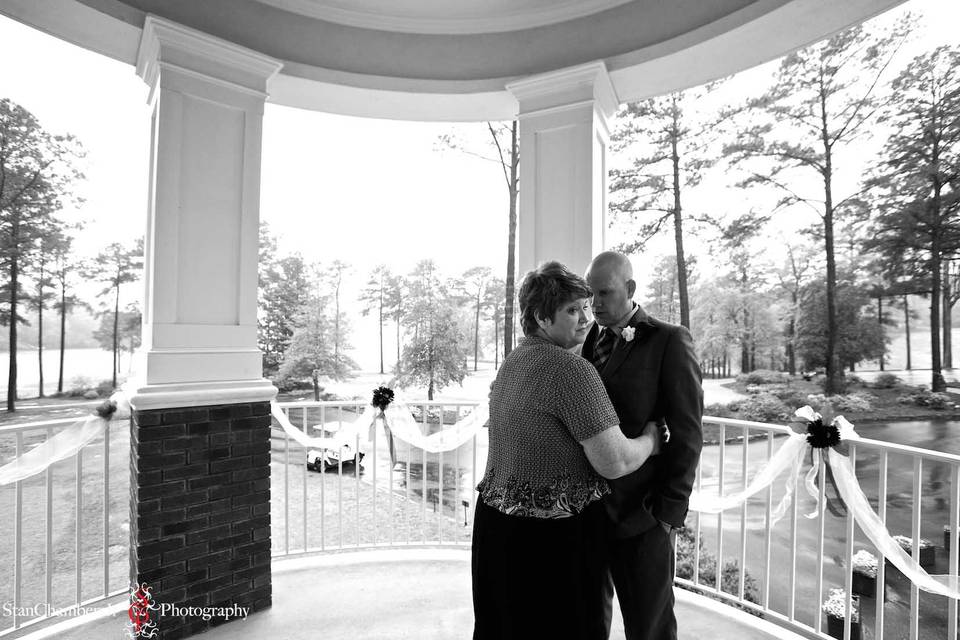 Groom & groom's mother embrace prior to the wedding ceremony. Photo by www.stanchambersjr.com.