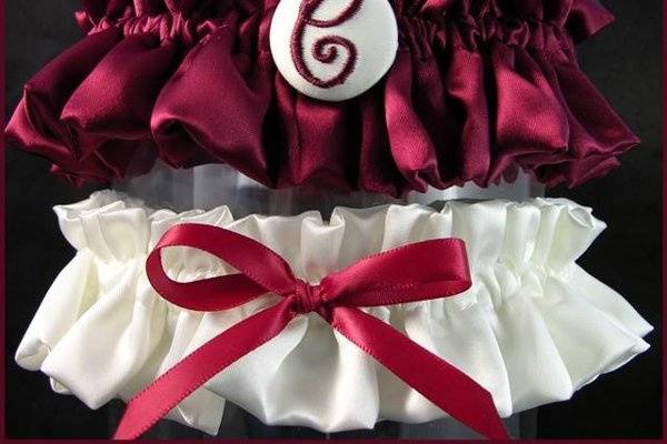 One to toss, and one to keep!  A one initial garter to keep forever, and a simple garter with bow to toss.