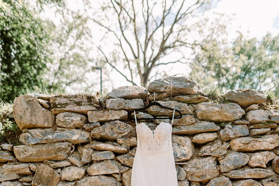 Lace dress hanging on rocks