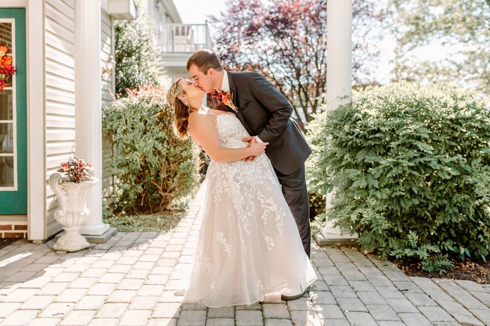 Groom dips bride