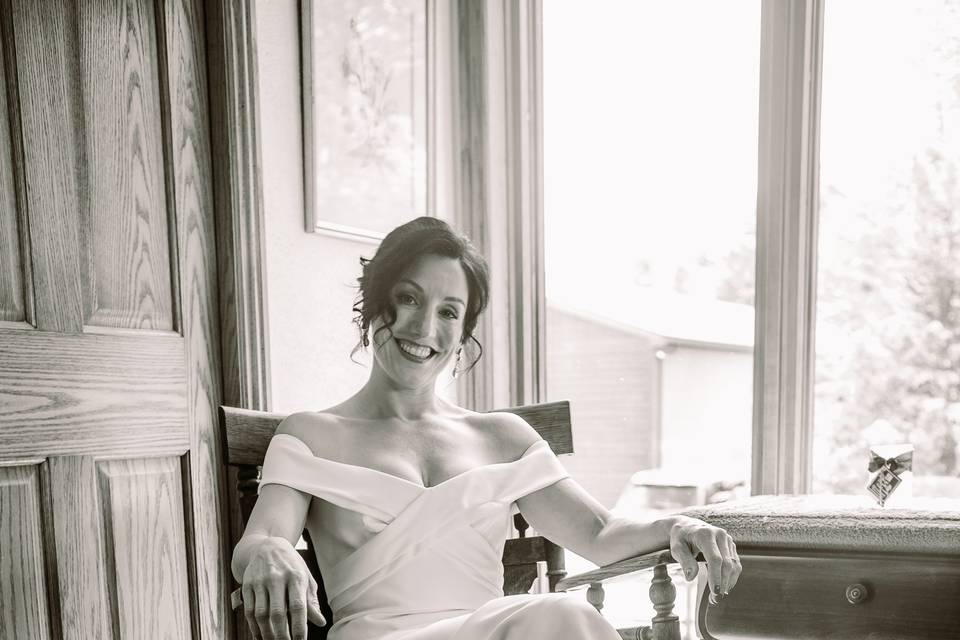 Bride sitting in rocking chair