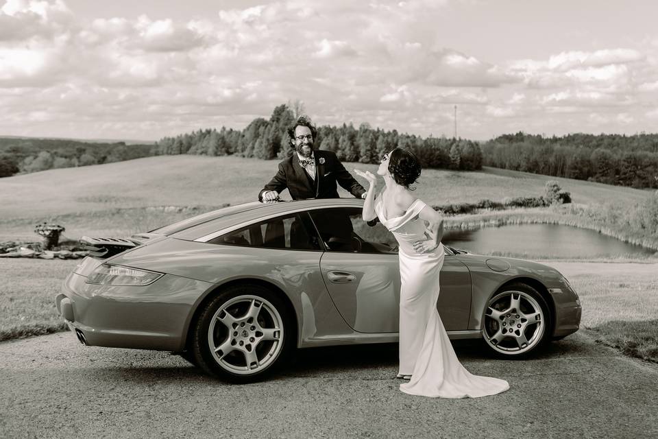 Bride blowing kiss at groom