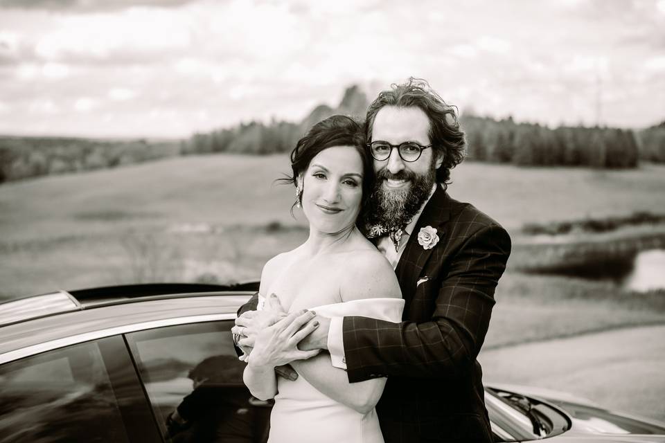 Groom holds bride lovingly