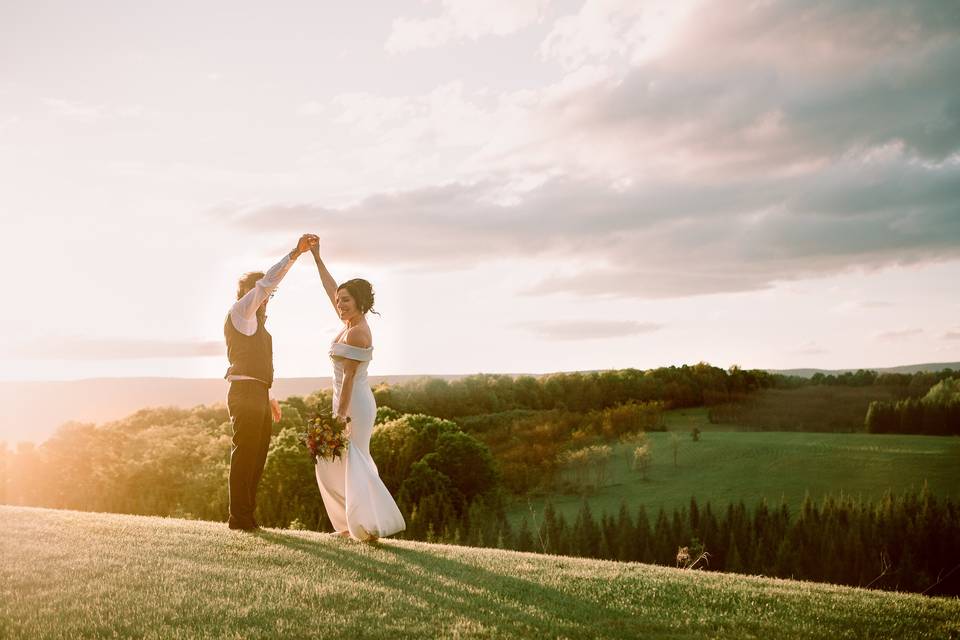 Couple spin on mountain side