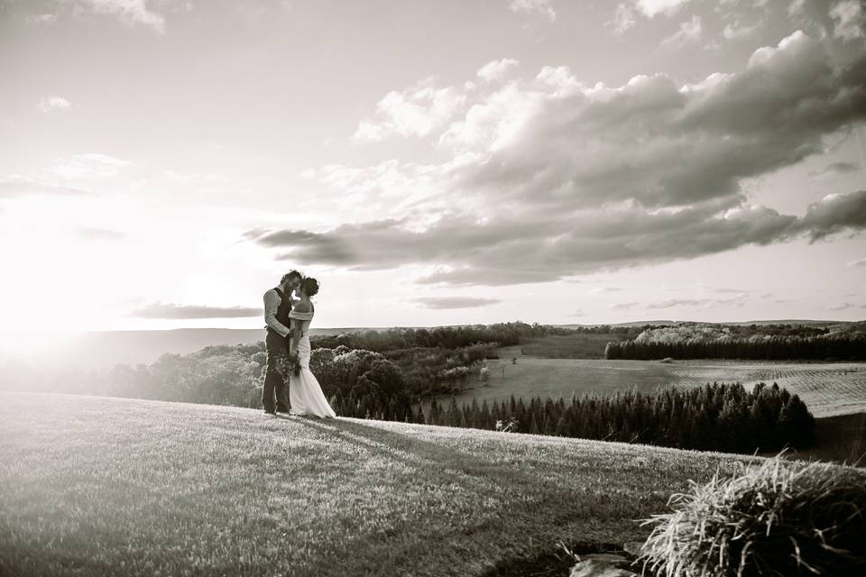 Couple share a kiss at sunset