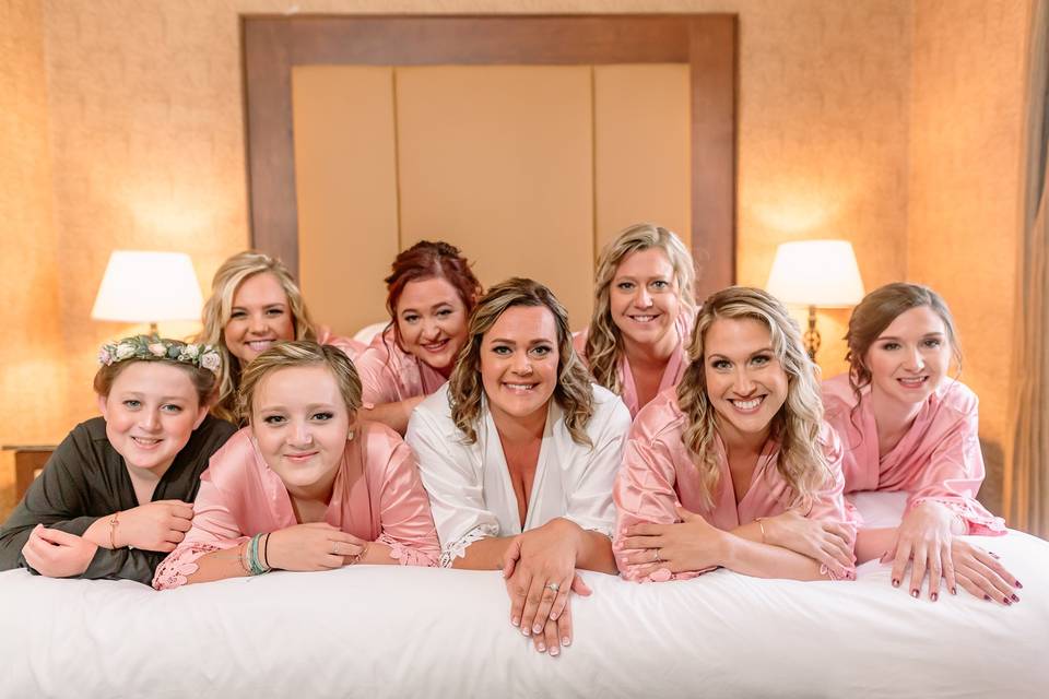 Bridesmaids group on bed