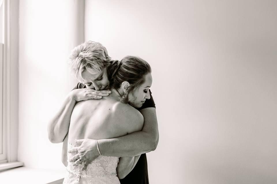 Bride hugs her mother