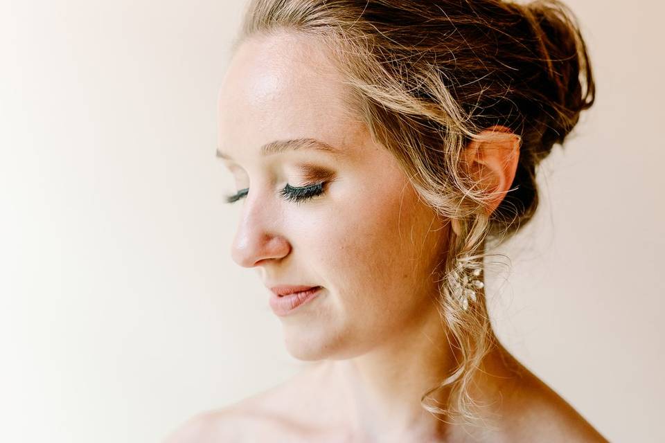 Bride looking down in makeup