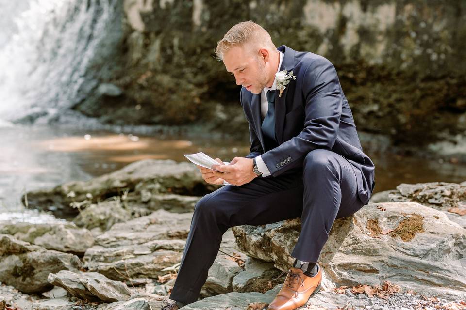 Groom reading love letter