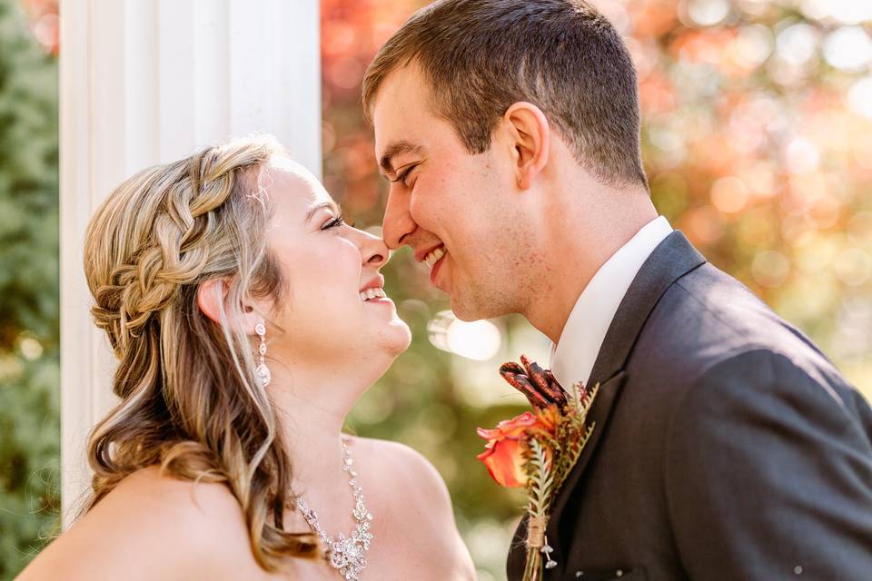 Bride and groom touch noses