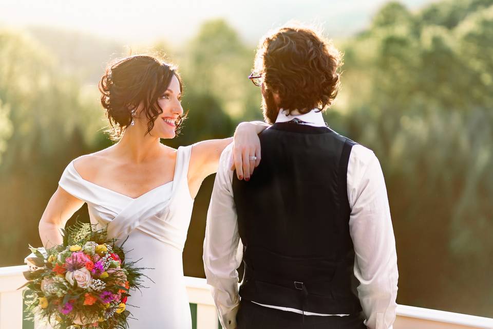 Brides arm on grooms shoulder