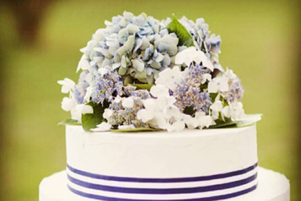 White wedding cake with blue stripes