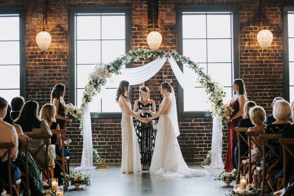 Two brides at the alter