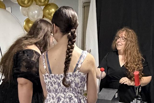 Guests watch as magnet is made
