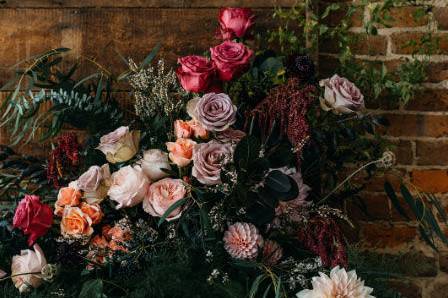 Wedding fireplace installation in moody colors: Inner Images Photography