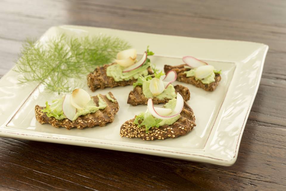 fava bean puree on rustic toasts with caramelized shallots