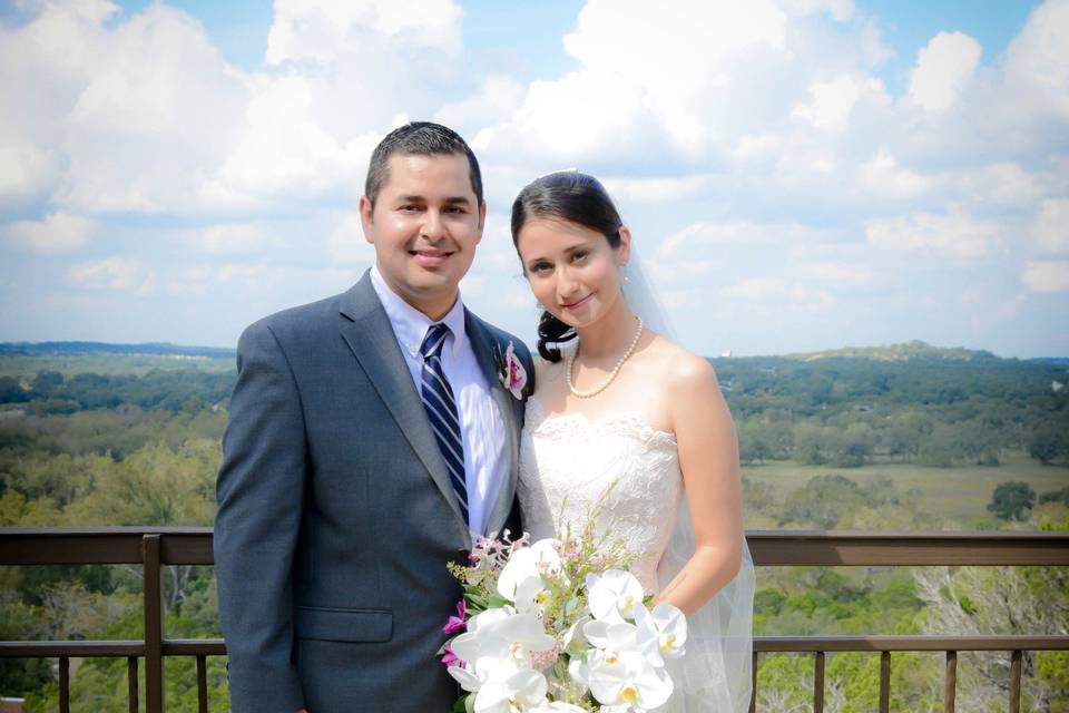 Groom and bride by the rails