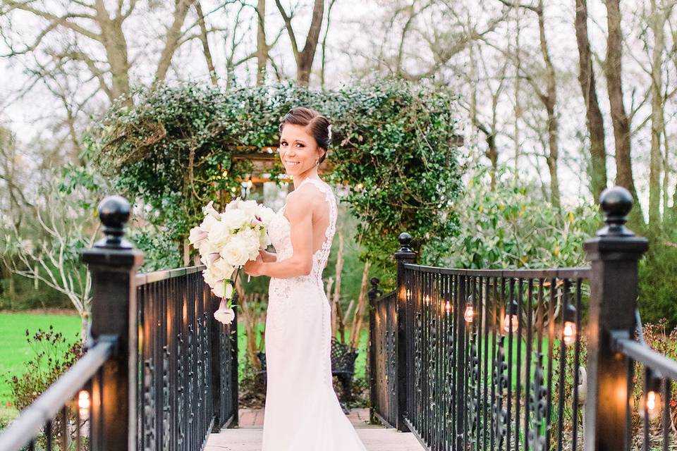 Bride walking over the iron bridge