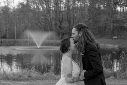 Couple in front of pond