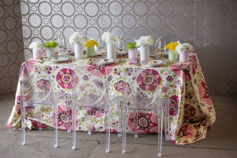 Patterned reception table cloth and floral decor