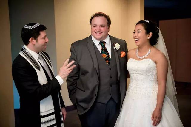 The officiant and the newlyweds