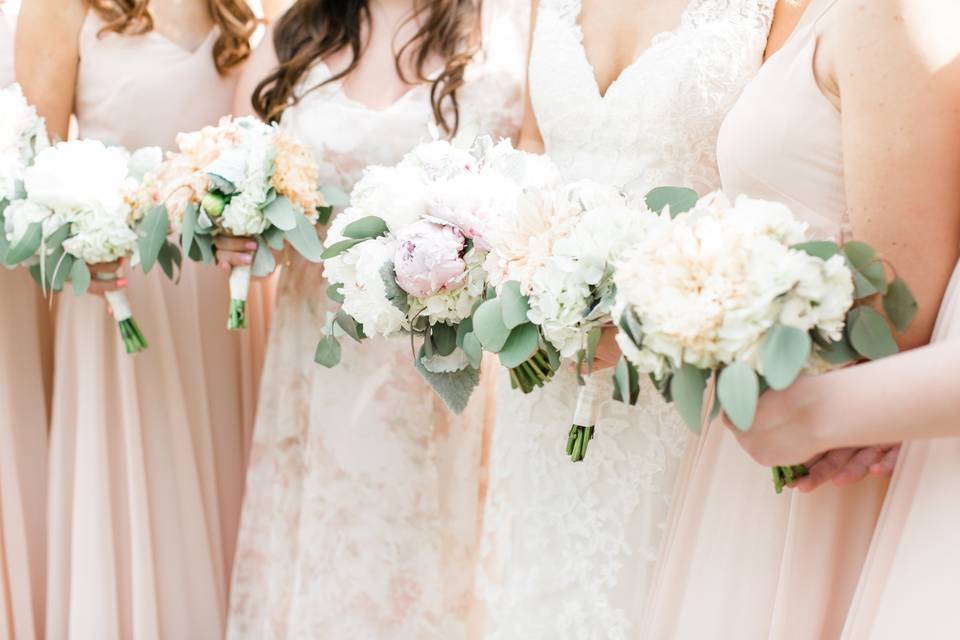 Peach dresses and white bouquets