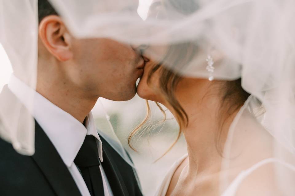 Veil shot bride and groom