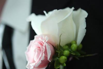 White and pink rose boutonniere