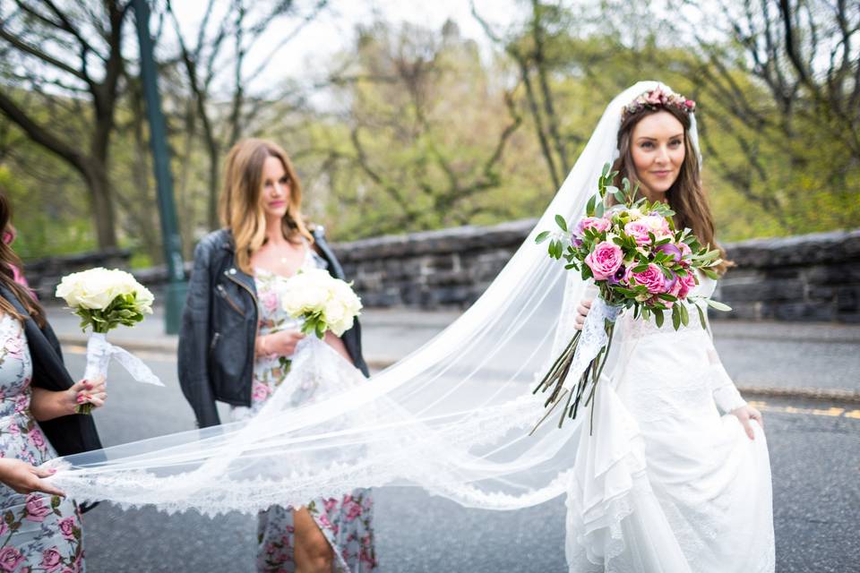 Holding the bride's veil