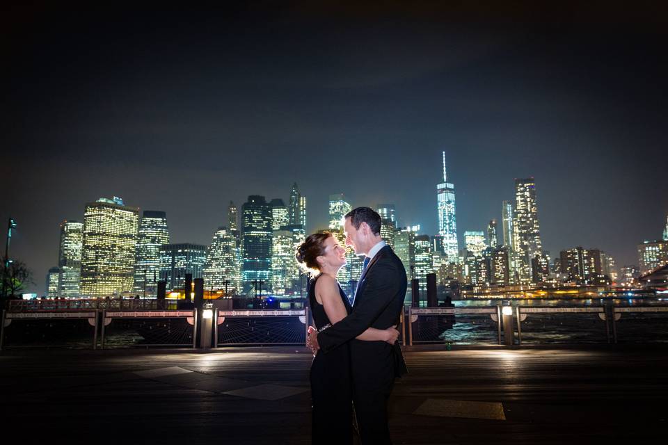 Bride and groom overlooking the city lights