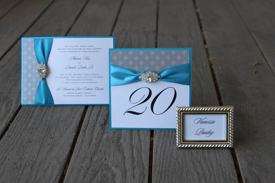 Teal and silver collection, invitation with brooch, table number and framed place card