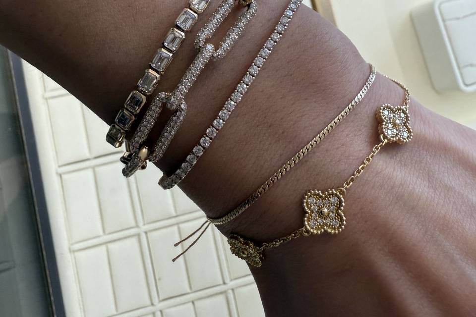 diamond-tennis-bracelets-clover-charm-gold-on-wrist-haejin-jewelry-brooklyn.jpg