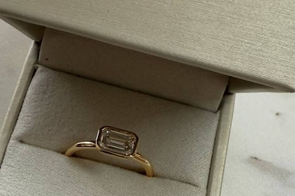 emerald-cut-bezel-engagement-ring-east-west-yellow-gold-haejin-brooklyn.jpg
