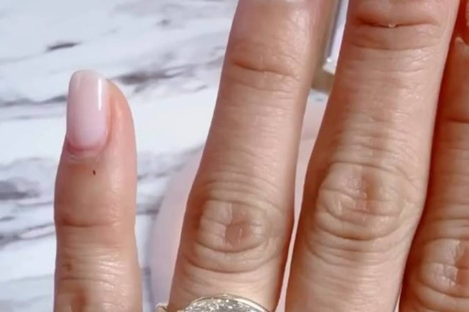 emerald-cut-engagement-ring-on-hand-natural-light-haejin-jewelry-williamsburg.jpg