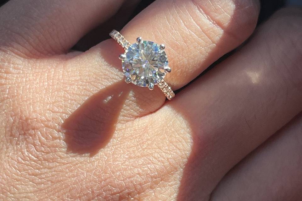 round-solitaire-engagement-ring-pave-band-on-hand-haejin-jewelry-brooklyn.jpg