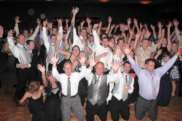 The couple with the bridesmaids and groomsmen